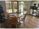 Dining area features a wood table and chairs, located next to the kitchen and backyard at 2649 N 85Th Ave, Phoenix, AZ 85037