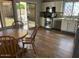 Eat-in kitchen with stainless steel appliances, white cabinets, and access to the backyard at 2649 N 85Th Ave, Phoenix, AZ 85037