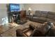 Cozy living room with comfortable seating, a large area rug, and plenty of natural light at 2649 N 85Th Ave, Phoenix, AZ 85037