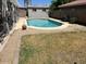 Backyard pool with a well-kept lawn area, providing a serene outdoor retreat at 2649 N 85Th Ave, Phoenix, AZ 85037