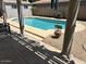 Inviting pool surrounded by well-maintained landscaping, perfect for outdoor relaxation and enjoyment at 2649 N 85Th Ave, Phoenix, AZ 85037