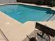 Backyard swimming pool with steps and coping, with a 'Welcome to Our Home' sign at 2649 N 85Th Ave, Phoenix, AZ 85037