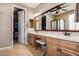 Spacious bathroom with double vanities, granite countertops, and a large mirror at 2680 E Lodgepole Dr, Gilbert, AZ 85298