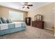 Neutral bedroom with ceiling fan, carpeted floor, and traditional wood furniture at 2680 E Lodgepole Dr, Gilbert, AZ 85298