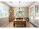 Bright dining room with a chandelier and a view to the outdoor space at 2680 E Lodgepole Dr, Gilbert, AZ 85298