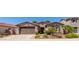 Charming single-story home featuring a well-maintained front yard with desert landscaping and a two car garage at 2680 E Lodgepole Dr, Gilbert, AZ 85298