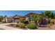 Beautiful home featuring desert landscaping, a palm tree, and a two-car garage at 2680 E Lodgepole Dr, Gilbert, AZ 85298