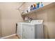 Laundry room with washer and dryer and built-in shelving above at 2680 E Lodgepole Dr, Gilbert, AZ 85298