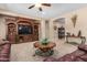 Spacious living room with carpet flooring and a built-in entertainment center at 2680 E Lodgepole Dr, Gilbert, AZ 85298