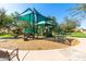A well-equipped playground with shade structures in a neighborhood park at 2680 E Lodgepole Dr, Gilbert, AZ 85298