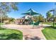 Community playground with slides, play structures, shade and benches at 2680 E Lodgepole Dr, Gilbert, AZ 85298