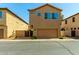 Exterior view of the property displaying the garage, walkway, and a well-maintained facade at 3485 S Seneca Way, Gilbert, AZ 85297