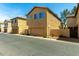 Tan two-story home featuring a garage and desert landscaping for low-maintenance appeal at 3485 S Seneca Way, Gilbert, AZ 85297