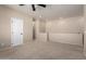 Open loft area features neutral walls, carpet flooring, ceiling fan, and recessed lighting at 3485 S Seneca Way, Gilbert, AZ 85297