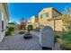 Private backyard with pavers, a built-in bench, and a cozy fire pit perfect for entertaining at 3566 S Colorado St, Chandler, AZ 85286