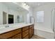 Bathroom featuring double sinks, a large mirror, and a separate shower at 3566 S Colorado St, Chandler, AZ 85286