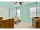Bright bedroom features a ceiling fan, two windows, and a charming teepee at 3566 S Colorado St, Chandler, AZ 85286