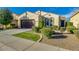 Inviting single-story home with a well-maintained front yard, featuring a two-car garage and appealing landscaping at 3566 S Colorado St, Chandler, AZ 85286