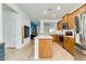 Well-lit kitchen with stainless steel appliances, center island, and wood-look flooring at 3566 S Colorado St, Chandler, AZ 85286