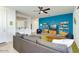 Cozy living room with a comfortable sectional sofa, accent wall, and a view into the kitchen at 3566 S Colorado St, Chandler, AZ 85286