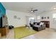 Comfortable living room with tile floors, a ceiling fan, and a large sectional sofa at 3566 S Colorado St, Chandler, AZ 85286