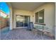 Patio with brick pavers, dining table and chairs, lounge chair, and view of the fenced yard at 3566 S Colorado St, Chandler, AZ 85286
