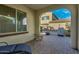 Covered patio with brick pavers, dining table and seating, and outdoor kitchen in backyard at 3566 S Colorado St, Chandler, AZ 85286