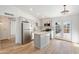 Bright, remodeled kitchen features stainless steel appliances, kitchen island, and stylish backsplash at 3646 N 69Th Ave # 55, Phoenix, AZ 85033