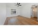 Spacious living room with hardwood flooring, ceiling fan, and great natural light at 3646 N 69Th Ave # 55, Phoenix, AZ 85033