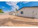 Backyard showing the property's exterior and an empty lot at 3802 W Mission Ln, Phoenix, AZ 85051