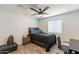 Bedroom features a ceiling fan, modern wood flooring, and ample natural light at 3802 W Mission Ln, Phoenix, AZ 85051