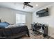 Bedroom with ceiling fan and gray flooring at 3802 W Mission Ln, Phoenix, AZ 85051
