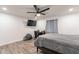 Bright bedroom with ceiling fan, desk and gray scale design at 3802 W Mission Ln, Phoenix, AZ 85051