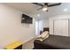 Modern bedroom with ceiling fan, closet and desk at 3802 W Mission Ln, Phoenix, AZ 85051