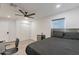 Modern bedroom with a platform bed, mini-fridge, and a large closet, offering a minimalist yet comfortable space at 3802 W Mission Ln, Phoenix, AZ 85051
