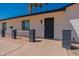 Close-up of a charming house with fresh paint, stylish railings, and drought-resistant landscaping leading to the front door at 3802 W Mission Ln, Phoenix, AZ 85051