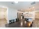 Bright and spacious kitchen featuring stainless steel appliances, white cabinetry, an island, and an adjacent dining space at 3802 W Mission Ln, Phoenix, AZ 85051