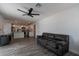 Open-concept living room flowing into kitchen with modern lighting and comfortable seating at 3802 W Mission Ln, Phoenix, AZ 85051