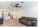 Spacious living area featuring durable floors, recessed lighting, and an open layout connecting to a modern kitchen at 3802 W Mission Ln, Phoenix, AZ 85051