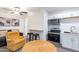 Cozy living room with adjacent kitchen and stainless steel appliances at 3802 W Mission Ln, Phoenix, AZ 85051