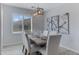 Dining room features modern decor with statement lighting, rustic table and seating for six at 3843 E Hazeltine Way, Chandler, AZ 85249