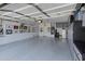 Well-organized garage featuring epoxy flooring, storage cabinets, and space for parking and hobbies at 3843 E Hazeltine Way, Chandler, AZ 85249