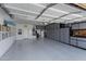 Spacious garage with ample storage cabinets, epoxy floor, and organized layout, perfect for vehicles and projects at 3843 E Hazeltine Way, Chandler, AZ 85249