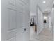 Hallway leading to a living room with a view of the open floor plan and neutral decor at 3843 E Hazeltine Way, Chandler, AZ 85249