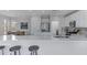 This modern kitchen offers sleek countertops and stainless steel appliances with barstool seating at 3843 E Hazeltine Way, Chandler, AZ 85249