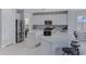Modern kitchen featuring stainless steel appliances, white cabinets, and sleek countertops at 3843 E Hazeltine Way, Chandler, AZ 85249