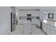 Modern kitchen featuring stainless steel appliances, white cabinets, and sleek countertops at 3843 E Hazeltine Way, Chandler, AZ 85249