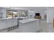 Open-concept kitchen featuring a large island, stainless steel appliances, and easy access to the outdoors at 3843 E Hazeltine Way, Chandler, AZ 85249