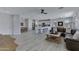 Spacious open-concept living room and dining room showcasing a kitchen with a central island at 3843 E Hazeltine Way, Chandler, AZ 85249