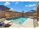 Beautiful pool with fountain features, lounge chairs, and lush landscaping creating a tranquil backyard escape at 3843 E Hazeltine Way, Chandler, AZ 85249